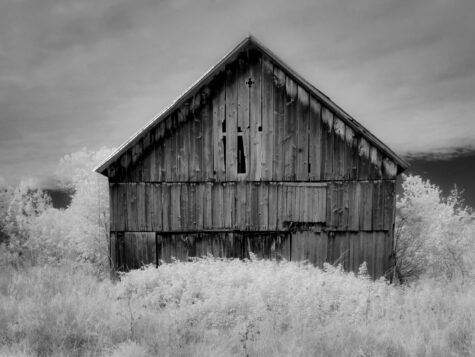 Black and white barn in Vermont mountain side